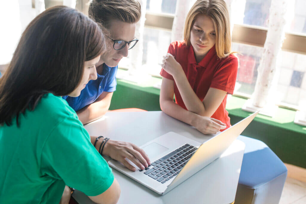 High school interns working together