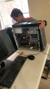 Praise-Him fixing a computer