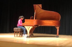 Nora playing piano