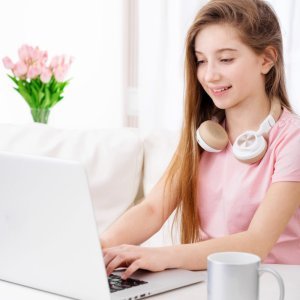 creative teenage girl in pink coding