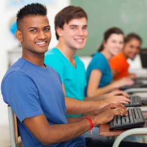 groups of teens in a coding class