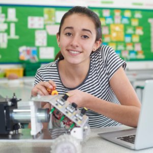 teenage girl in science class with computer